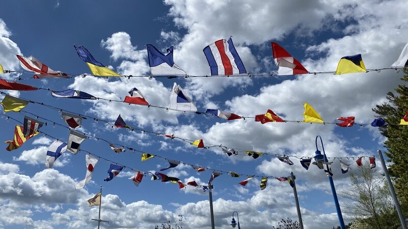 Nautical flags add to the decor of the the floating dock for the paddle boats.