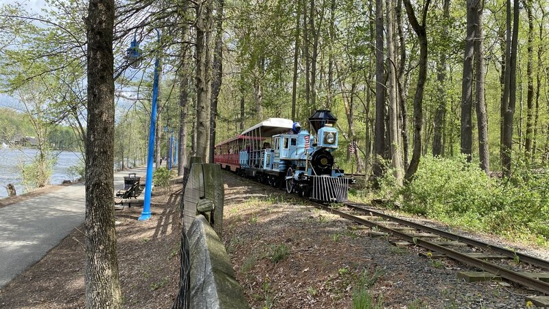 The tracks of the Turtle Back Zoo's miniature train ride run parallel to a section of the Orange Reservoir Loop. The miniature train ride is free for the zoo visitors (no separate tickets are sold).