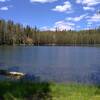 Red Cinder (center) at 8,375 ft., can be seen peeking out above the forest across Jakey Lake to the northeast.