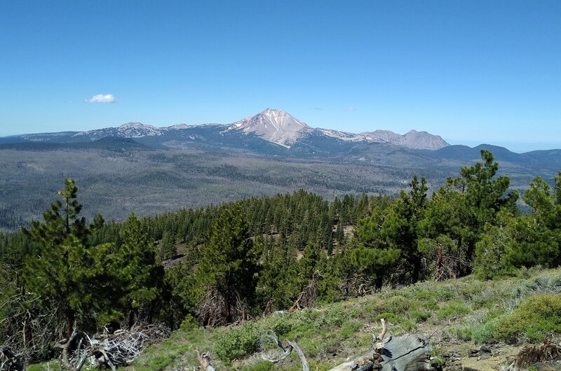 Looking southwest from the top of Prospect Peak: Lassen Peak (center), Chaos Crags (right center), and probably Mt. Conrad and Brokeoff Mountain (left center) in the far distance.