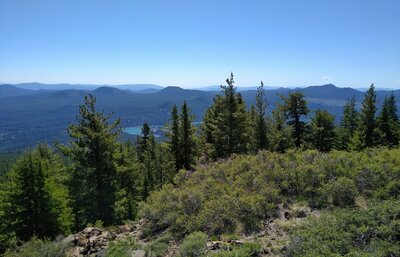 East-southeast from the top of Prospect Peak: Butte Lake below and beautiful forested hills stretching forever into the distance.