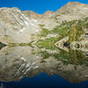 Morning reflection on Tower Lake. Trail to Tower Pass runs just below the trees on the left