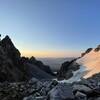 View to the east of the saddle, looking into Garnet Canyon and at Bradley Lake at the bottom. At sunrise.