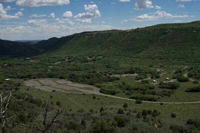 Looking back at the parking area and Morefield Campground from the trail as it climbs the hillside.