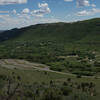 Looking back at the parking area and Morefield Campground from the trail as it climbs the hillside.