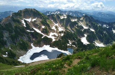 Blue Lake is far below the steep high meadows that Johnson Mountain Trail traverses.