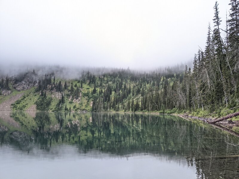 Black Lake western shore amid low clouds.