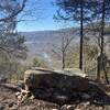 Rock bench overlooking the Archey Fork River at the end of the trail.