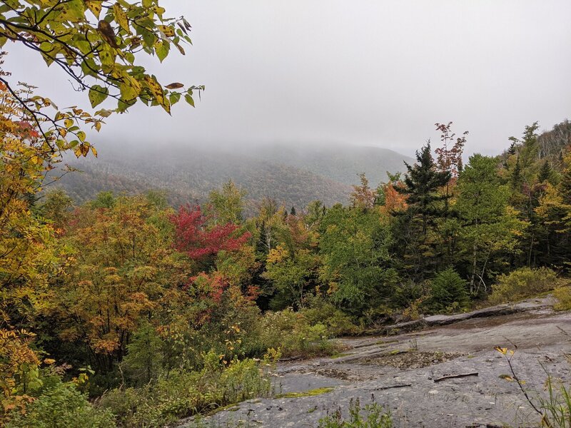 Overcast, early-autumn view at the bottom of a slide on the Boquet Forks trail to Grace Peak.