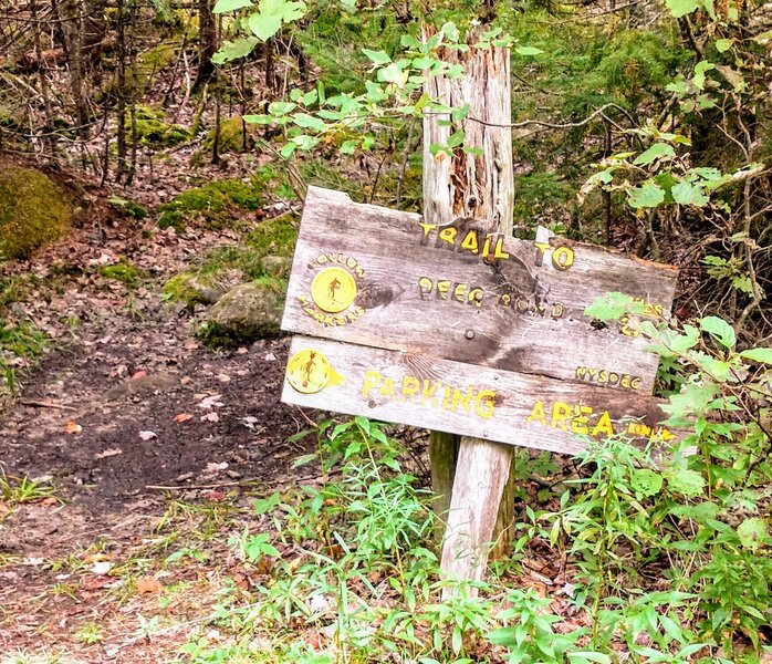 Trailhead sign at the Old Wawbeek Rd beyond the gate.