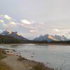 The Chaba River (right far valley) empties into the Athabasca River (center far valley) in front of unnamed center peak with snow capped Mount Quincy behind it on right. Seen looking south/upstream on the banks of the Athabasca at Big Bend trail camp.