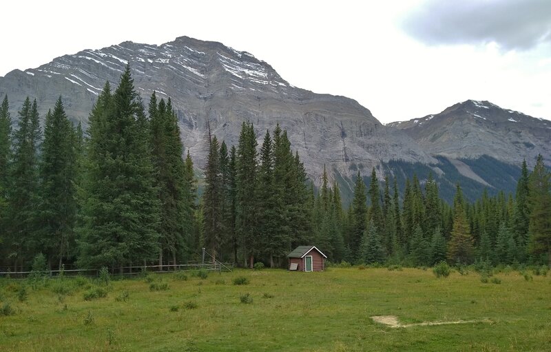 Directly to the south across the Snake Indian River, Mt. Simla, 9,140 ft., (left) is seen from the Blue Creek Warden Cabin's front yard.