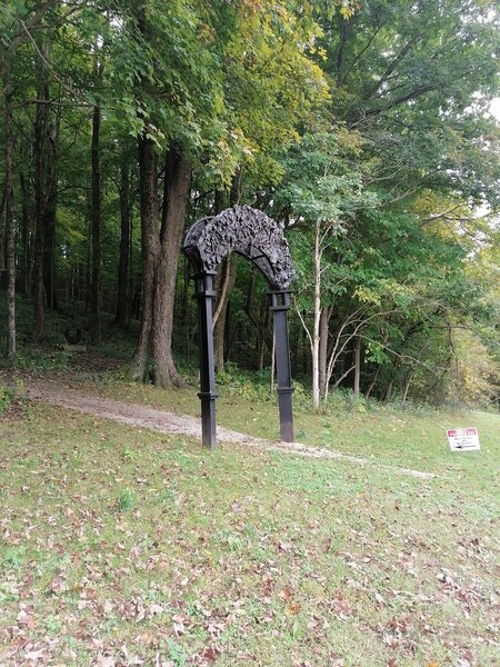 An impressive arch by artist Jack Gron. Not by the public parking lot, but close enough. GPS = 39.12152, -86.78441