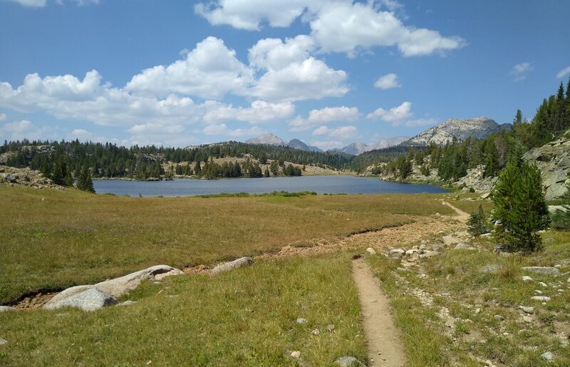 The CDT travels north along Dads Lake with (left to right) Mt. Geikie, 12,378 ft., unnamed, Tower Peak, 12,330 ft., and Mt. Hooker, 12,504 ft., in the distance.