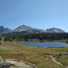 Yet another pretty little lake in the alpine meadows beneath the Continental Divide to the east.  Mountains (left to right) are Mt. Bonneville, 12,585 ft., Raid Peak, 12,532 ft., unnamed, Mt. Geikie, 12,378 ft.