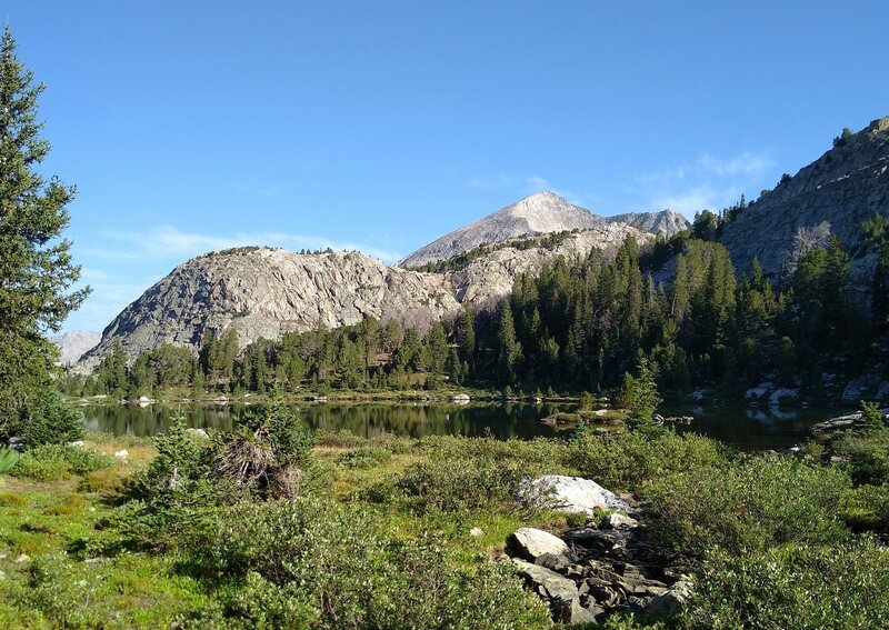 Still in the forest, this tiny lake is the first of five lakes when hiking up to Europe Pass. Mt. Victor, 12,254 ft., is the peak (center left) seen to the north-northwest from this lake.