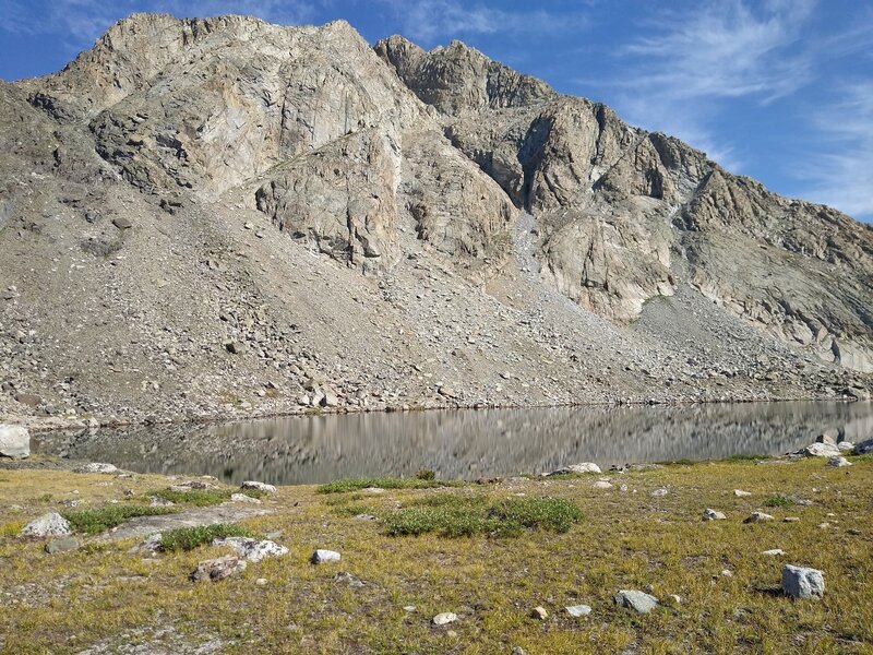 The third lake, Lake 10741, in the alpine meadows at the base of an impressive peak just a stone's throw from the Continental Divide. Looking northwest from the south end of Lake 10741.