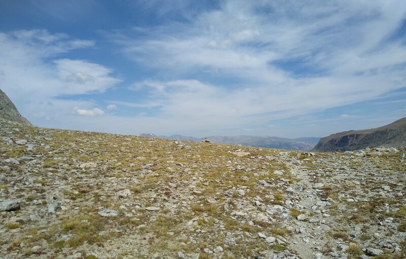 Cresting the Continental Divide at Europe Pass, 11,459 ft., from the west, there's the cairn (center), and a glimpse of what's to come on the east side of the Continental Divide.