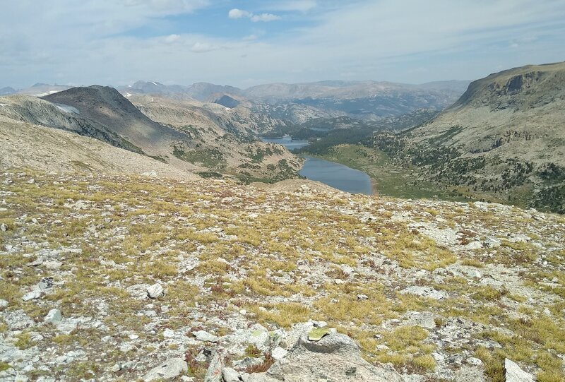 Standing at Europe Pass, 11,459 ft., looking north down the east side of the Continental Divide, there are the highest two Milky Lakes, a chain of lakes that stretches into the distance.