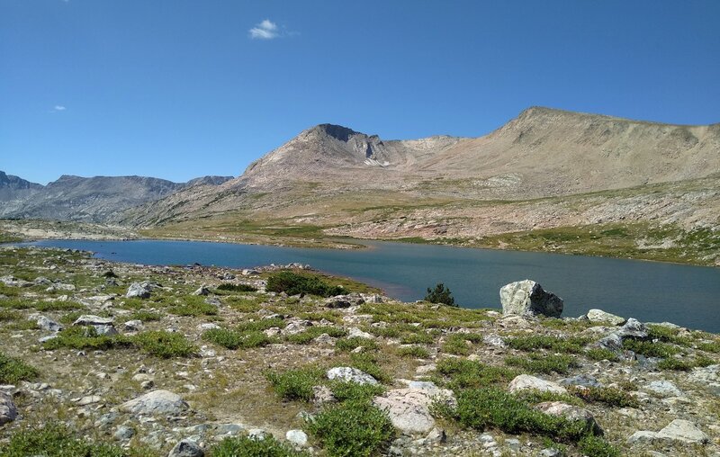 Round Top Mountain, 12,048 ft. (center) stands behind Beth Lake (Lake 10755) as we travel down (south) from Hay Pass on Hay Pass Trail. The ridge from the unnamed peak on the right, extends north/right to form part of the Continental Divide.