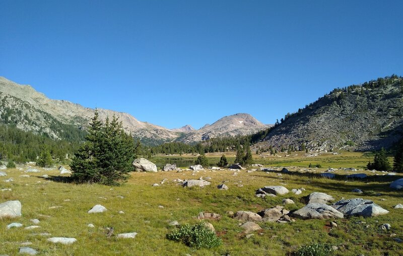 Pretty meadows with a small lake ahead to the north, along Hay Pass Trail. Further north (center right) is Round Top Mountain, 12,048 ft.