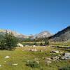 Pretty meadows with a small lake ahead to the north, along Hay Pass Trail. Further north (center right) is Round Top Mountain, 12,048 ft.