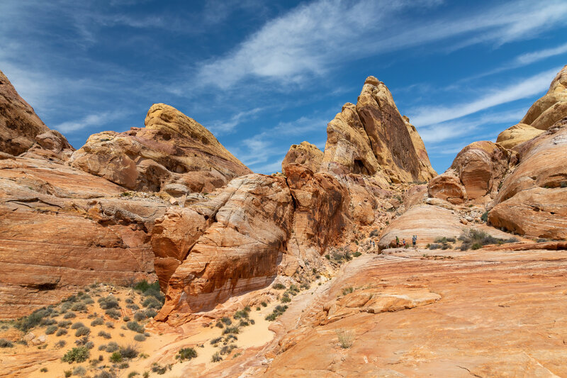 The trail leads up on the right side of the rock fin.