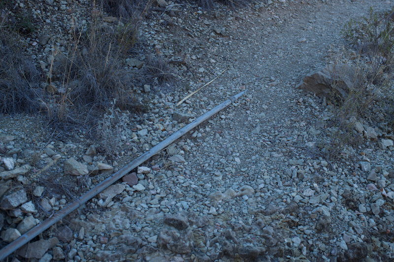 An irrigation pipe that use to provide water from the spring can be seen along the trail.