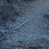 An irrigation pipe that use to provide water from the spring can be seen along the trail.