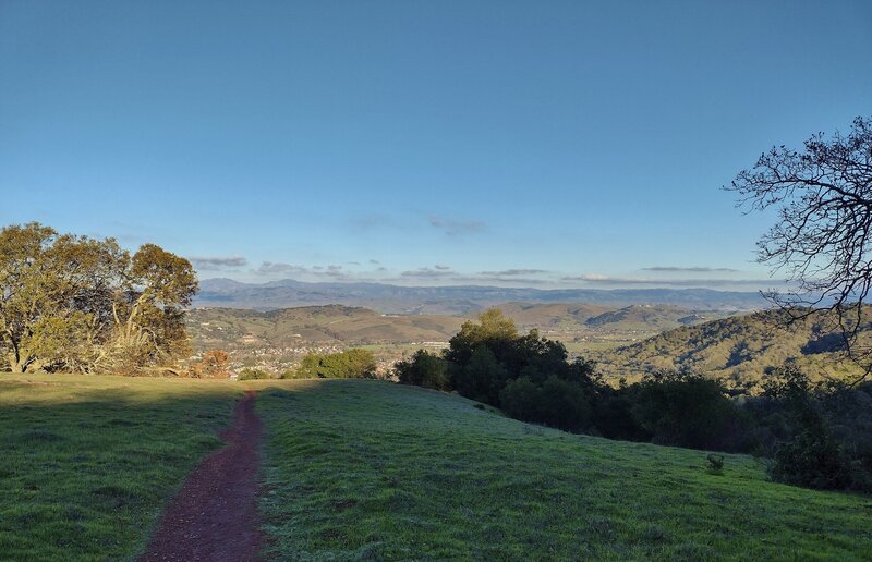 Lengthening late afternoon shadows with Almaden Valley below in the distance, at the foot of the Almaden Hills. The Diablo Range is in the far distance, with Mt. Hamilton and Copernicus Peak left center.  Heading down Prospect #3 Trail.