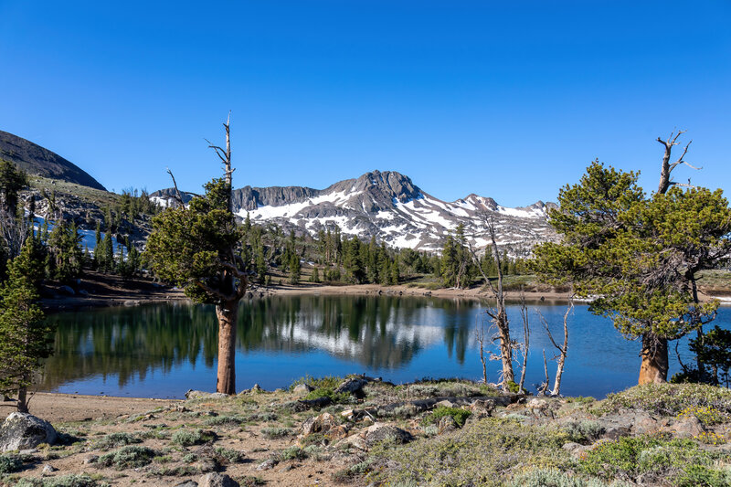 The reflection of Round Top in the calm waters of Frog Lake