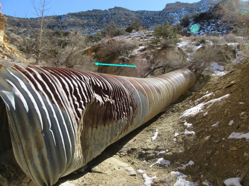 A rain storm moved this culvert into the canyon wash. Trail heads into the canyon to the left of this culvert.