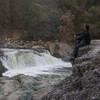 Perched on the boulders overlooking the waterfall