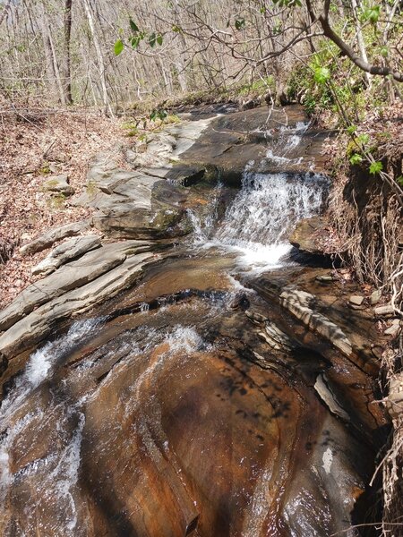 Feeder stream on east loop heading down to Creek, you can see the rock beginning to channel due to erosion.