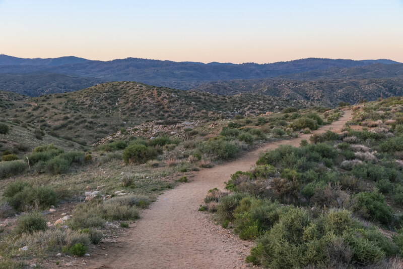 The hardpacked dirt trail is almost completely exposed and descends about 900' in elevation over the 1.75 mile hike to the hot springs pools.