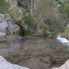 One of the warm soaking pools, set just beside the creek's edge.