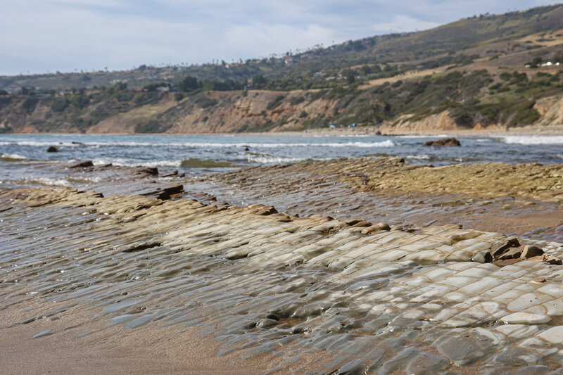 The constantly shifting landscape of Portuguese Bend has left some rock shelves at the edge of East Beach, just beneath the cliffs of Portuguese Point.