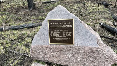 A plaque dedicated to the crew of a crashed airplane. This is at the end of what used to be the 4WD portion of the Flowers Rd. and the start of the Comanche Peak Wilderness/Flowers Trail.