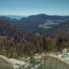 Looking southeast into the far distance from Cottonwood Pass. The forested hills and meadows of Golden Trout Wilderness are seen below.