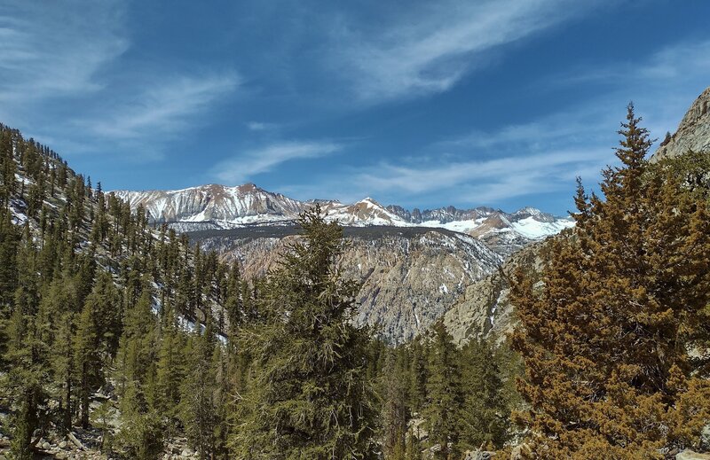 Red Spur ridge (left) rises up above the 3,000 foot Kern Canyon cliffs. In the far distance (left center to right) are the Kaweahs - Mount Kaweah, Red Kaweah, Black Kaweah, and Kaweah Queen. Looking southwest down the Wallace Creek valley.