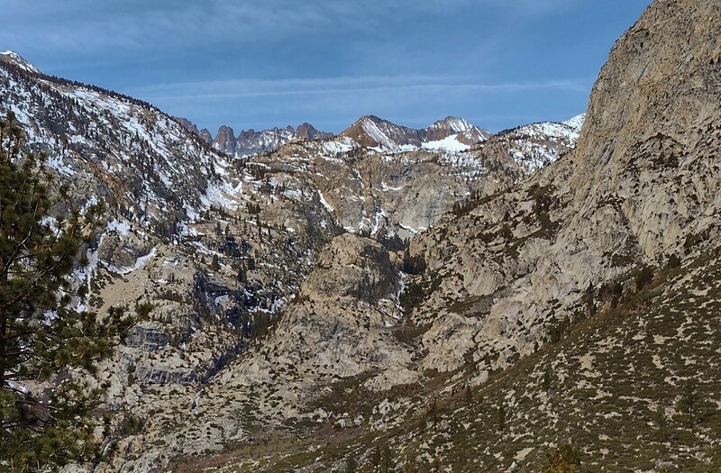 In the far distance (left to right) are most of the Kaweah Ridge - Red Kaweah, Black Kaweah, and Kaweah Queen.  They are seen above the Kern Kaweah River valley (center) where the Kern Kaweah River plunges down to meet the Kern River (hidden below).