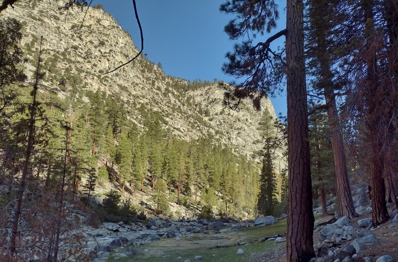 1500+ foot cliffs rise above the west banks of the Kern River, as the trail travels at the Kern Canyon bottom, through sequoias along its east banks. At Kern Hot Springs, look closely (bottom center) to see the hot springs hot tub in the meadow.