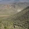 The trail descends steeply toward the fields outside Gardiner and the Yellowstone River.