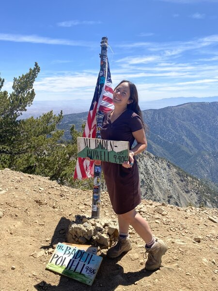 At the peak of Mt. Baden-Powell. As part of social hiking challenges, there are wood signs to pose with at the peak.