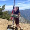 At the peak of Mt. Baden-Powell. As part of social hiking challenges, there are wood signs to pose with at the peak.