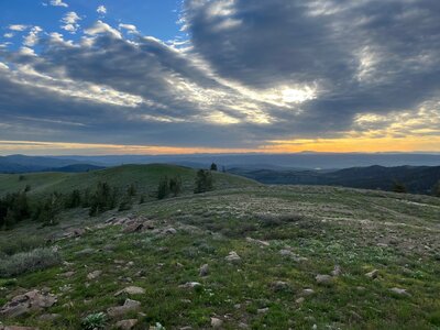 View of the Tetons and numerous other ranges from the summit of Peak 7936 on the Inkom Pass Loop