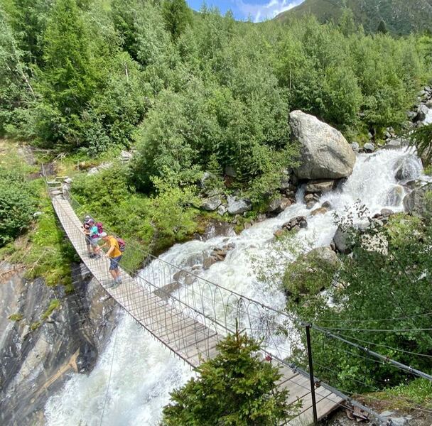 Fun suspension bridge over the Bionnassay Glacier outflow