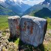 Old stone markers distinguish the border between France and Switzerland.