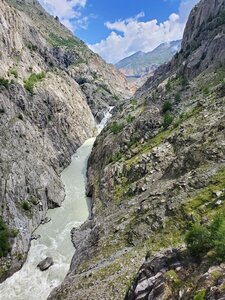 Can you spot the debris-covered snout of the glacier far up in the valley?