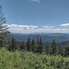 Forested hills stretch into the distance when looking southeast from the Canfield Mountain summit lookout.